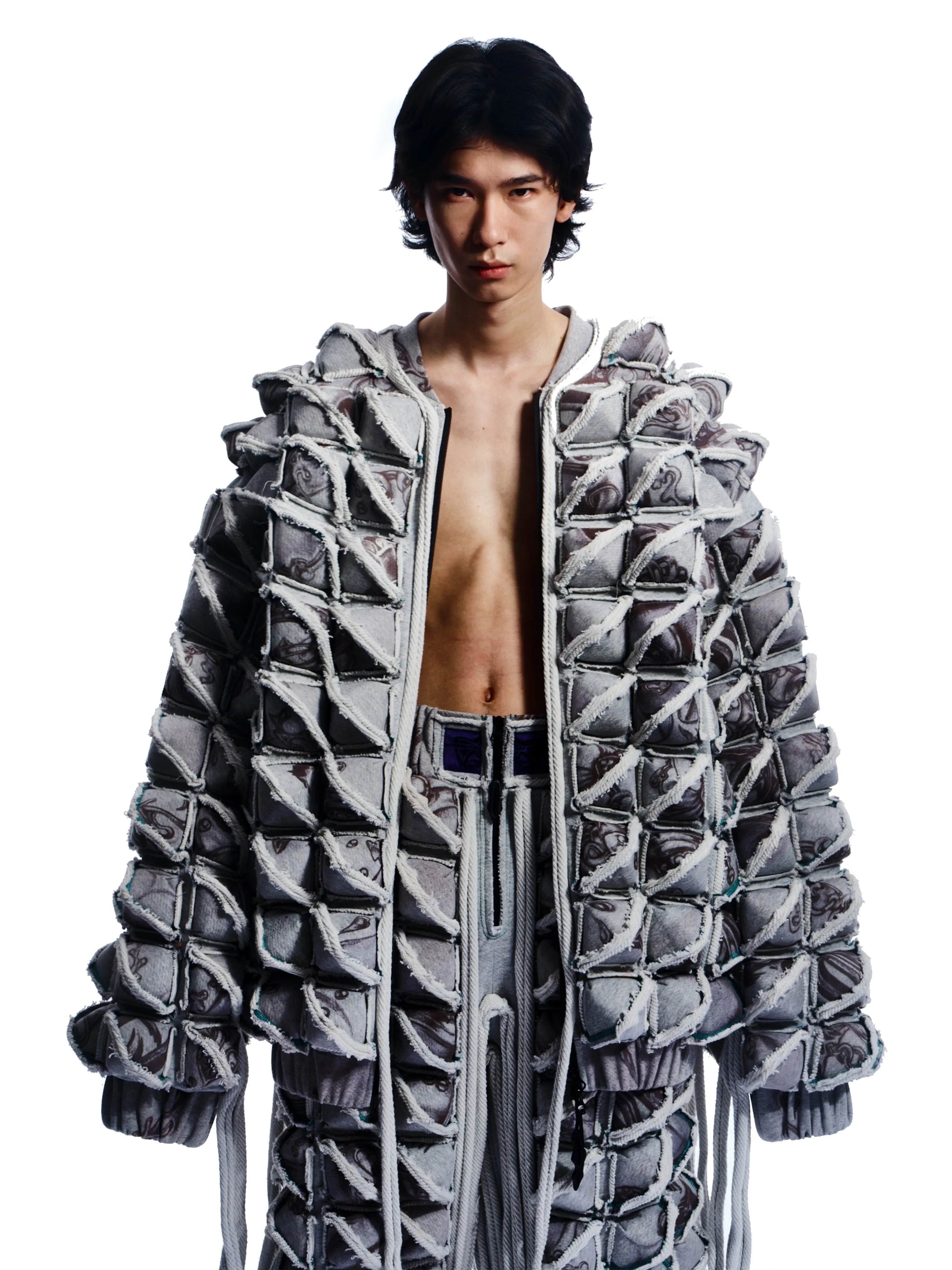 GRAPHIC SPIKED DEFENCE COAT WITH FRINGING